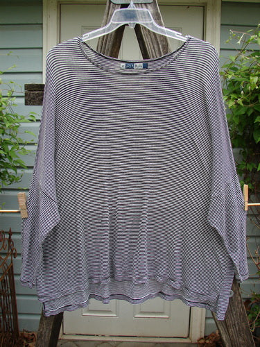 Barclay Organic Spandex Square Shirttail Top Black White Pinstripe Size 0 on a clothes hanger, showcasing its wide, boxy shape, dolman shoulders, and continuous pinstripe pattern with subtle vented sides.