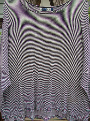 Barclay Organic Spandex Square Shirttail Top in Black White Pinstripe, featuring a rounded neckline, wide boxy shape, long sleeves, dolman shoulders, and tiny vented sides, showcasing BlueFishFinder's vintage style.