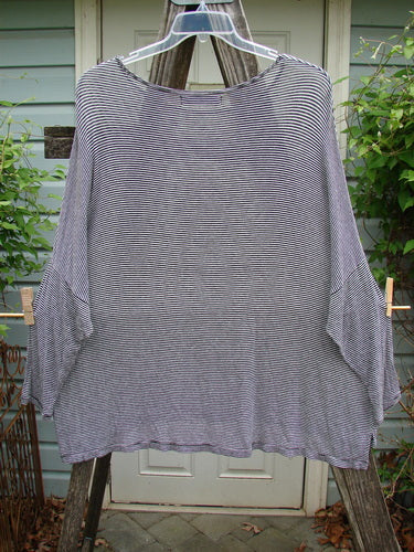 Barclay Organic Spandex Square Shirttail Top in Black and White Pinstripe, featuring a wide, boxy shape and three-quarter sleeves, displayed hanging on a clothesline.