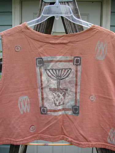 The 1994 Spruance Vest Topiary Cliff OSFA features a topiary-themed plant drawing, dual paper button closure, and wide A-line flare, reflecting Bluefishfinder.com's vintage, artistic clothing ethos.