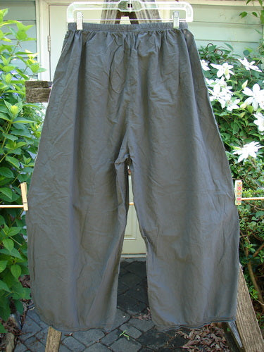 Barclay Batiste Tiny Flutter Pocketless Pant Unpainted Almost Black Size 0; lightweight cotton with unique sweet bottom flutter, full elastic waist, and slightly widening lowers, reflecting timeless vintage elegance from Bluefishfinder.com.