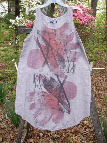 Barclay Linen Round Bottom Pinafore Flying Wing Mallow Size 0, showcasing a white shirt with pink leaf print, features a scoop neckline, widening A-line shape, and slightly belled side hemline.