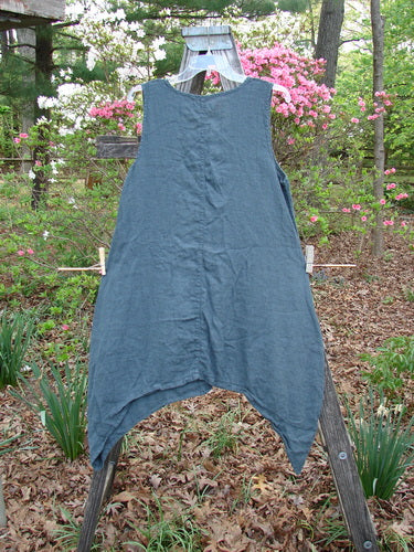 Barclay Linen Side Dip Pinafore Double Blossom Hunter Gray Size 0 displayed on a rack, showcasing its scoop neckline, widening A-line shape, and unique double blossom pattern, embodying vintage Blue Fish Clothing style.