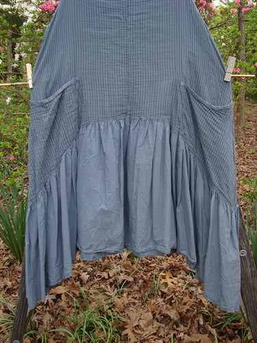 Barclay Gauze Dual Pocket Varano Jumper Unpainted Stripe Moss Size 0 hanging on a clothesline, showcasing its medium-weight organic cotton gauze fabric and distinctive yoke and pockets.