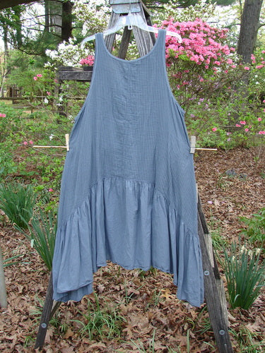 Barclay Gauze Dual Pocket Varano Jumper displayed on a wooden ladder, showcasing its oval neckline, deep arm openings, and dual exterior pockets, embodying vintage style from Bluefishfinder.com.