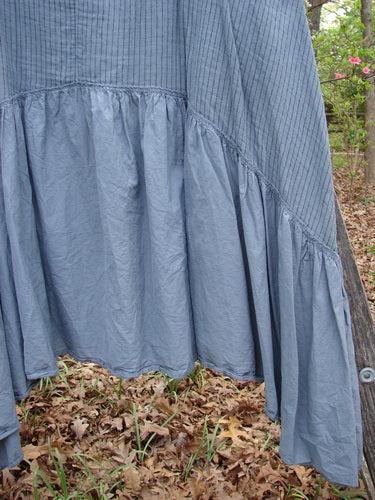 Barclay Gauze Dual Pocket Varano Jumper Unpainted Stripe Moss Size 0 draped on a tree, showcasing its unique design with deep pockets, oval neckline, and medium weight organic cotton gauze texture.