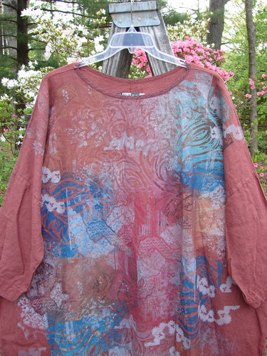 Barclay Linen Oversized Canyon Dress Floral Mountain Brick OSFA displayed on a swinger, showcasing its three-quarter length dolman sleeves, rounded neckline, and generous wide straight shape.