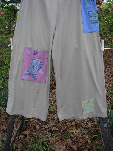 1997 Cubist Pant Top Hat Wheat Altered Size 1 features patchwork designs, oversized pockets with vintage buttons, a drawstring waist, and wide, belled lowers, showcasing unique Blue Fish vintage style.