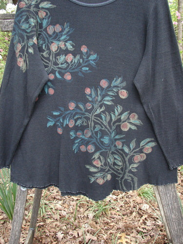 Barclay Thermal Bamboo V Bottom Top Berry Branch Black Size 2 features a floral design on a black sweater with long sleeves and a widening shape, showcasing a rounded neckline and unique hemline.