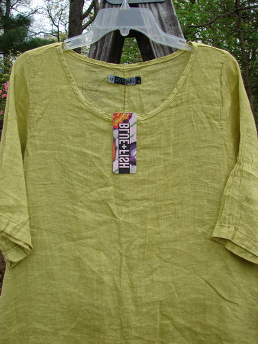 Barclay NWT Linen Springtime Top, Citron size 0, featuring a rounded neckline and flowy A-line shape, displayed on a hanger with a visible tag, highlighting its lightweight linen fabric.