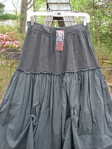 Barclay NWT Linen Batiste Fusion Pant Skirt hangs on a clothesline, showcasing its elastic waistline and layered skirt design with tie accents, embodying Bluefishfinder.com's unique, vintage-inspired style.
