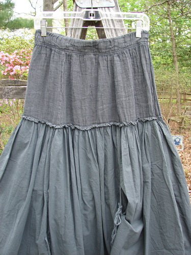 Barclay NWT Linen Batiste Fusion Pant Skirt Unpainted Ironworks Size 0 hanging on a clothesline, showcasing its layered design and tie accents for a unique, airy style.