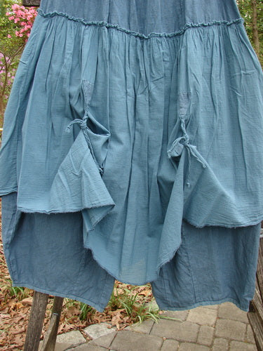 Barclay Linen Batiste Fusion Pant Skirt Unpainted Teal Size 0, featuring ruffles and double tie accents, showcases a unique layered design with elastic waistline and sectional panels for a distinctive look.