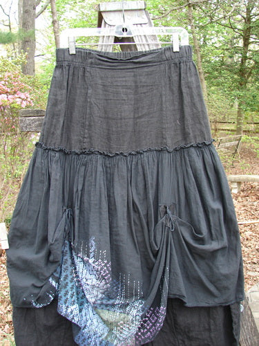 Barclay Linen Batiste Fusion Pant Skirt Galaxy Black Size 0, displayed outdoors, features a unique blue pattern, elastic waist, dual ties, and layered design, embodying Blue Fish Clothing's creative fashion ethos.
