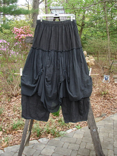 Barclay Linen Batiste Fusion Pant Skirt Galaxy Black Size 0 displayed on a wooden rack, highlighting its elastic waistline and dual tie accents, embodying Bluefishfinder.com's vintage, expressive fashion ethos.