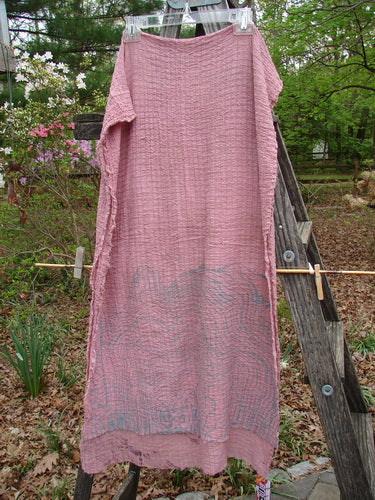 Barclay NWT Crinkle Cotton Scarf Wheat Field Plum Rose OSFA elegantly displayed on a wooden ladder, showcasing its soft texture and unique wheat field theme. Perfect as a shawl or wrap.