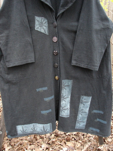 1994 Reprocessed Carriage Coat Forest Path Redyed Edo Black OSFA features a billowy collar, oversized vintage buttons, deep side pockets, and a varying hemline, embodying vintage elegance and unique design from BlueFishFinder.com.