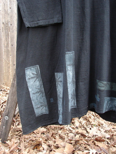 1994 Reprocessed Carriage Coat Forest Path Redyed Edo Black OSFA, featuring a billowy collar, oversized buttons, and deep side pockets, displayed with striking blue designs on a black fabric.