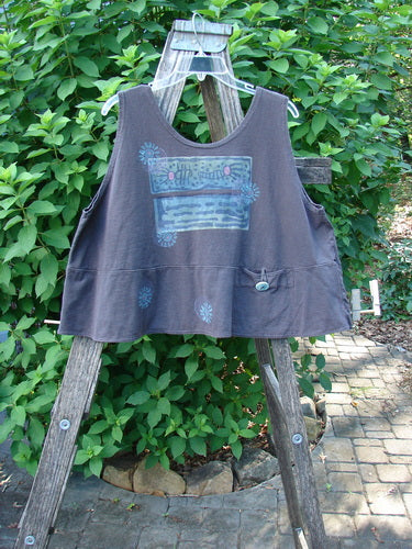 1995 Klee Top Garden Friends Shadow Size 1, a sleeveless, loose-cut top featuring a swingy A-line crop shape with a scoop neckline, displayed on a hanger against a natural background.