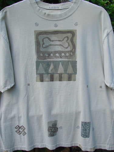 1995 Short Sleeved Crop Tee Doggie Bone Beach Glass Size 1 features a painted doggie bone theme with geometric accents, drop shoulders, and a ribbed neckline, highlighting Bluefishfinder.com's vintage, creative style.