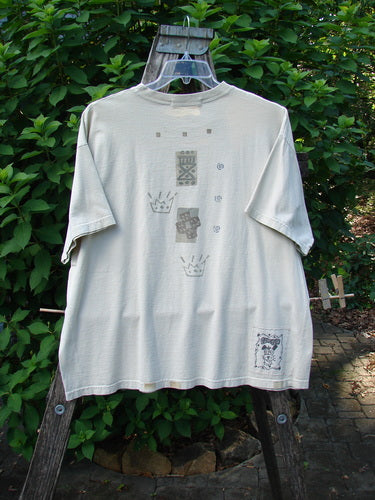 1995 Short Sleeved Crop Tee Doggie Bone Beach Glass Size 1 displayed on a swinger, showcasing its doggie bone pattern and signature Blue Fish patch, emphasizing its unique, vintage appeal from Bluefishfinder.com.