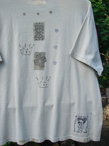 1995 Short Sleeved Crop Tee Doggie Bone Beach Glass Size 1 features a doggie bone design, drop shoulders, and a ribbed neckline, reflecting Bluefishfinder.com's vintage charm and creative individuality.