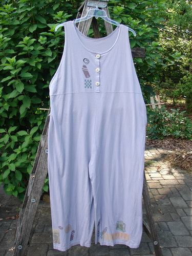 1993 Wide Pant Overall Jumper Travel Wind Periwinkle Size 2 displayed on a clothesline, showcasing super wide swingy belled legs, original front buttons, and a back gathered upper shoulder.