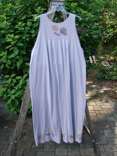 1993 Wide Pant Overall Jumper Travel Wind Periwinkle Size 2 displayed outdoors, showcasing its super wide swingy belled legs, original front buttons, and beautifully gathered back on a clothes rack.