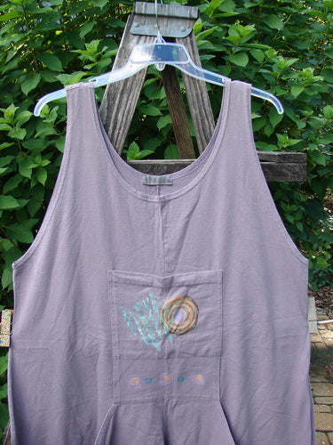 1997 Farmer Brown Overall Ocean Life Jasmine OSFA featuring a whimsically painted dual front bushel pocket and wide swingy lower paneled legs, displayed on a wooden swing, embodying playful, vintage style.