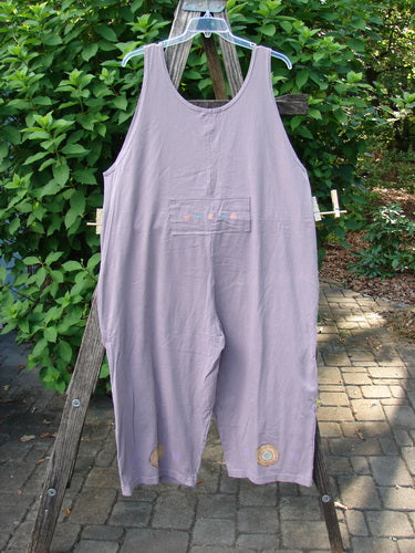 The 1997 Farmer Brown Overall Ocean Life Jasmine OSFA features whimsical ocean-themed paint, dual front bushel pockets, and wide, swingy legs, perfect for expressing creative individuality.