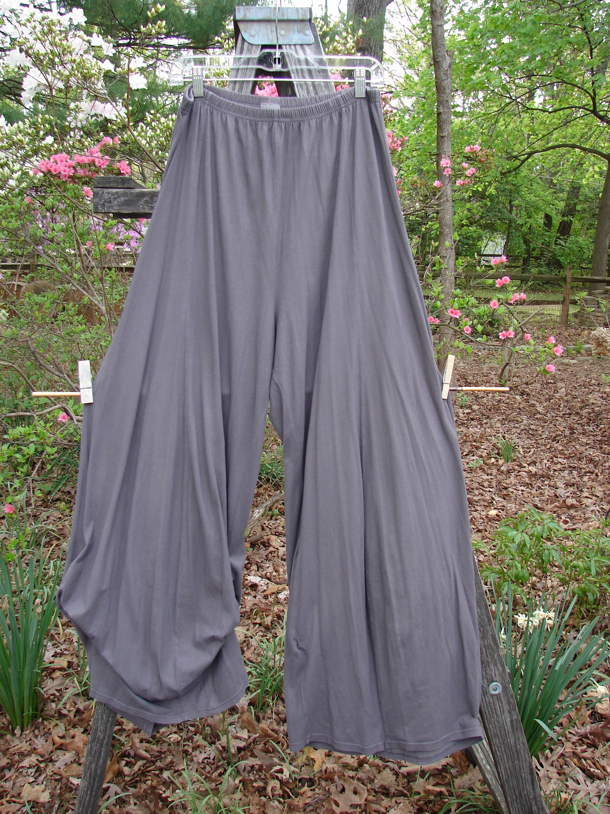 Barclay Lightweight Tie Bottom 4 Square Pant in Grey Granite, featuring a pocketless design and billowing lower fall, displayed hanging on a clothesline.