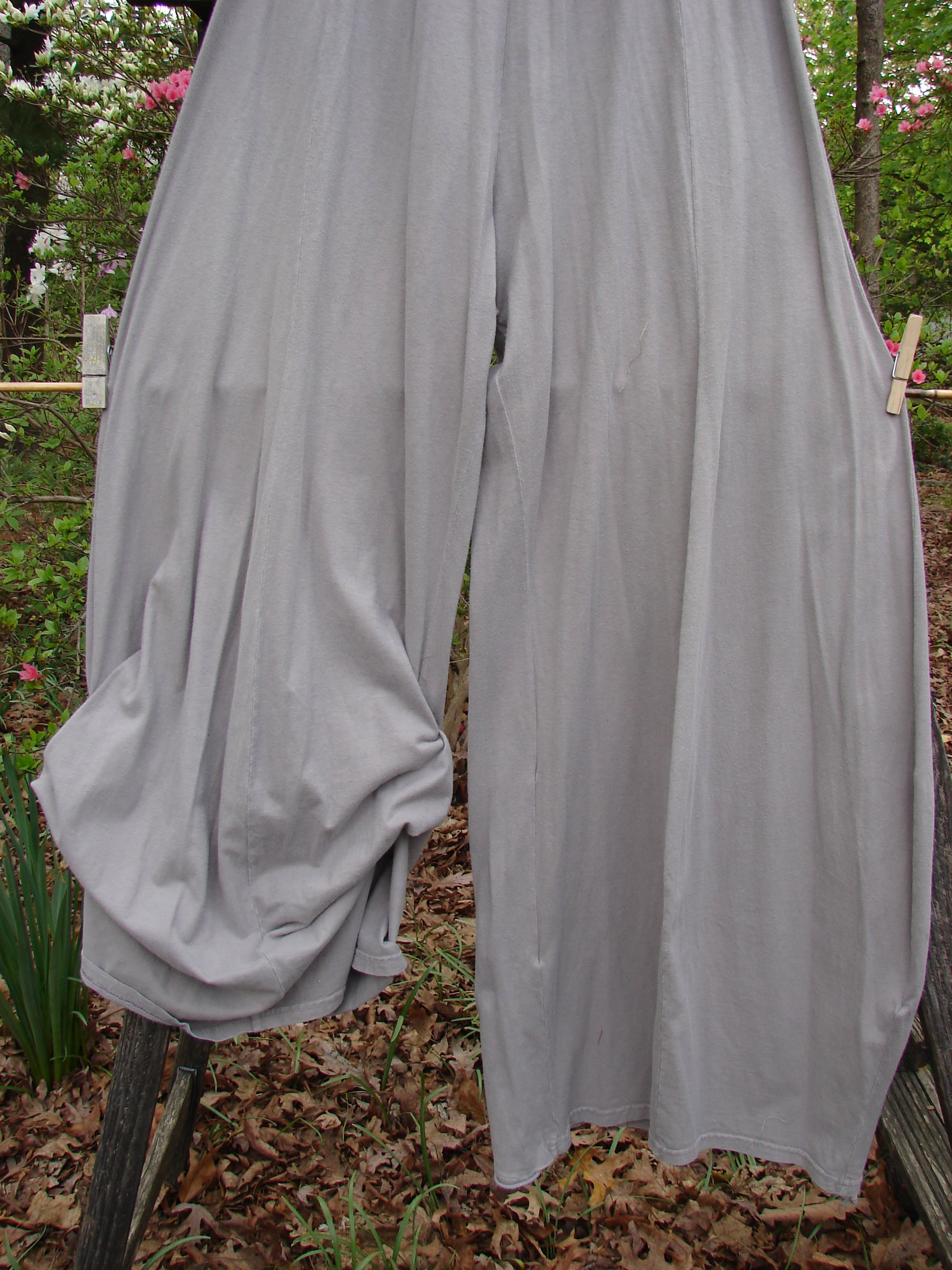 Barclay Lightweight Tie Bottom 4 Square Pant Unpainted Sand Size 0, hanging on a clothesline, showcases its elastic waistline and billowing lower fall in an outdoor setting.