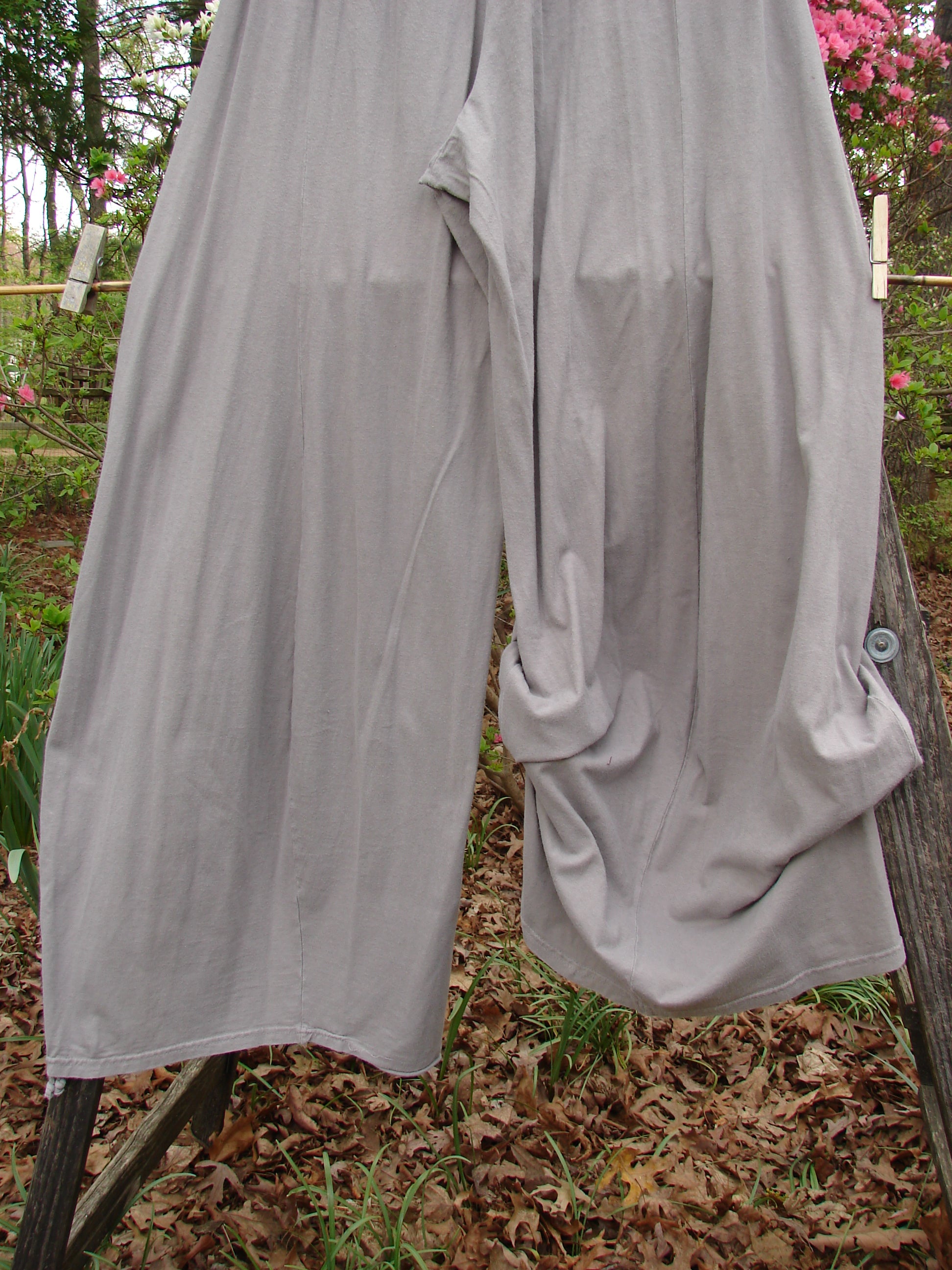 Barclay Lightweight Tie Bottom 4 Square Pant Unpainted Sand Size 0 hanging on a clothesline, showcasing its billowing lower fall and professionally replaced elastic waistline, ideal for mixing and matching.
