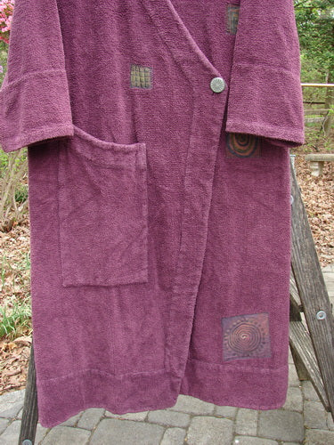 2000 Patched Chenille Side Wrap Robe, featuring a unique wrap front, oversized pocket, and wide sleeves, displayed on a wooden ladder. Made from dense cotton chenille, ideal for vintage fashion enthusiasts.