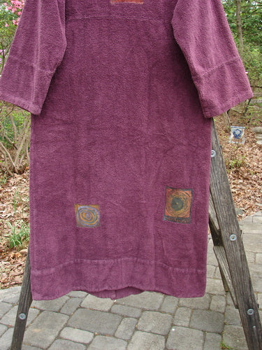 2000 Patched Chenille Side Wrap Robe Turn Time Murple Size 0 draped on a wooden rack, showcasing its unique wrap front, oversized pocket, and wide sleeves, symbolizing BlueFishFinder's vintage elegance.