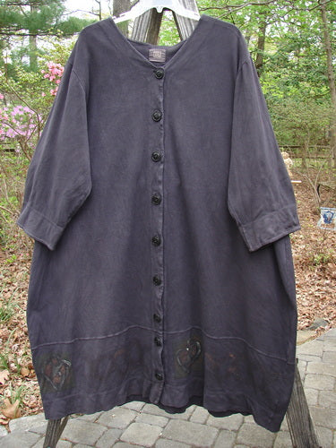 2000 Interlock Glassgow Coat Dress Celtic Black Size 2 displayed outdoors, highlighting its oversized buttons, wide swingy hem, and classic Celtic theme paint, embodying Bluefishfinder.com's unique vintage style.
