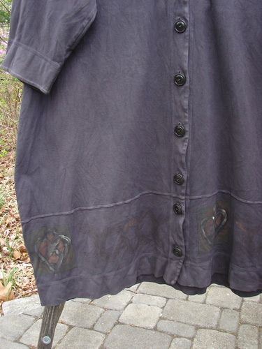 2000 Interlock Glassgow Coat Dress Celtic Black Size 2, featuring oversized buttons, wide swingy hem, and distinctive Celtic theme paint, showcased in a close-up that highlights its detailed craftsmanship and generous silhouette.