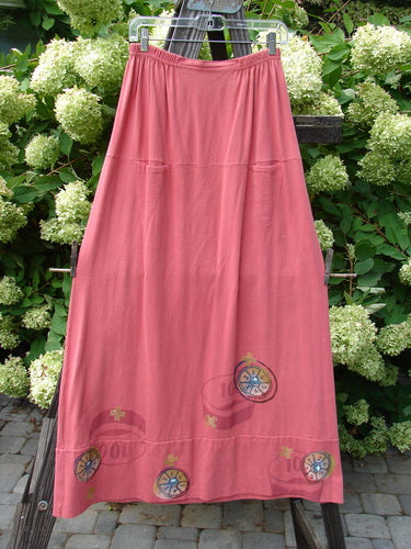 1998 Scrabble Skirt Games Cerise Size 2 displayed on a clothes rack, showcasing its waistline with flat folded front, rear elastic, horizontal panels, and two upper finger pockets.