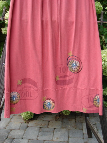 1998 Scrabble Skirt Games Cerise Size 2: Mid-weight organic cotton skirt with flat folded front, rear elastic, horizontal panels, lower banded wider sweep, two upper finger pockets, and a classical games theme paint.