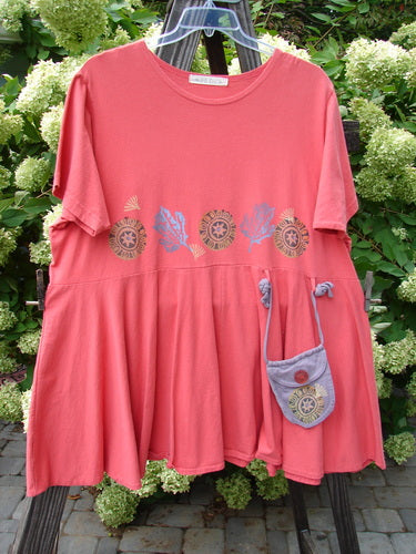 1997 Ocean Pearl Dress Star Coral Firefly Size 2 displayed on a rack with a small purse, featuring a sweet tiny painted pocket and coordinating ties, highlighting its summery look and empire waist seam.
