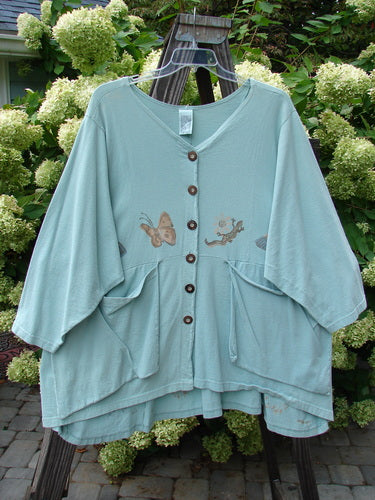 1994 Treasure Jacket Garden Friend Sea Water OSFA, featuring a butterfly design, nine-button front, drop shoulder seams, and floppy pockets with button closure, showcasing Blue Fish's vintage, artistic craftsmanship.