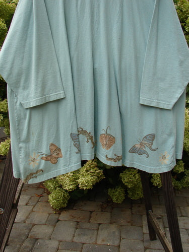 1994 Treasure Jacket Garden Friend Sea Water OSFA, featuring a light blue, long-sleeved design with butterfly patterns, front floppy pockets, and a nine-button closure.