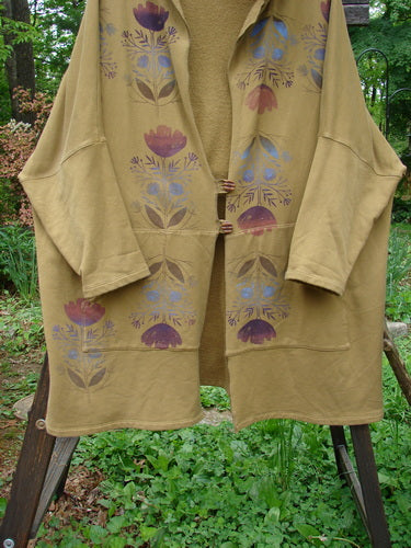 Barclay Fleece Two Button Hooded Jacket in Yellow Olive, featuring purple floral patterns, dolman sleeves, wooden buttons, and exterior pockets, showcased from the Fall Collection in size 3.