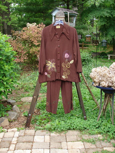 Barclay Tencel Collar Drawstring Studio Duo Spin Flower Sepia Size 1: A brown shirt and pants on a rack, featuring a flower design.