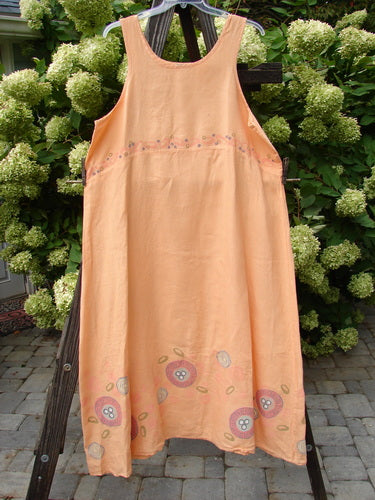 Barclay Linen A Line Shift Dress Bubbles Sherbet Size 2 displayed on a clothes rack, showcasing its rounded neckline, empire waist seam, and fully sweeping lower skirt.