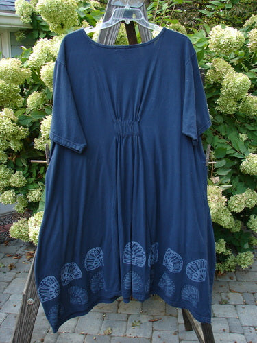 Barclay Farmer Jen Tunic Dress Shell Flower Navy Size 2 hanging on a clothesline, showcasing its generous measurements, superior shell flower design, oversized pockets, and deeper rounded neckline.