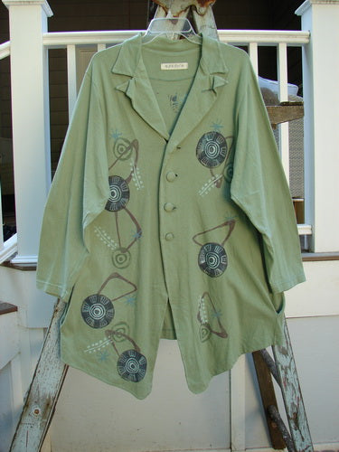 1996 Boulevard Jacket Giant Pinwheel Spanish Moss Size 0: A funky, uptown jacket with a button-accented and cut collar, button-tabbed back, varying shirttail hemline, and two side pockets. Painted in a giant pinwheel theme, this tailored jacket is a sure hit for any Blue Fish collector!