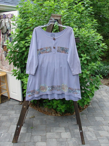 1993 Sparrow Dress: Cotton jersey dress with yoked waist seam, wooden button closure, varying hemline, and vintage mixed theme paint. Bust 48, Waist 48, Hips 54, Sweep 80, Front Length 34, Back Length 37.