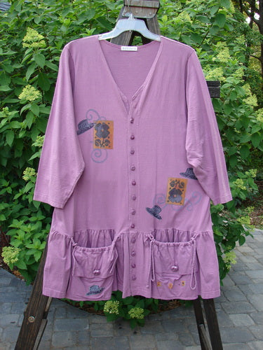 1997 Belladonna Jacket Tall Hat Geranium Size 1: A purple dress with a design on it, featuring a flirtatious bottom flounce and coordinating knotted buttons.