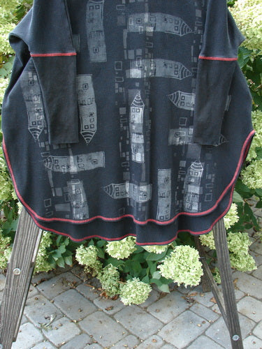 Barclay Thermal Contrast Revival Top Continuous Cityscape Black OSFA, featuring contrasting ribbed sleeves and neckline, rounded varying A-line shape, easy side vents, and cityscape theme paint.